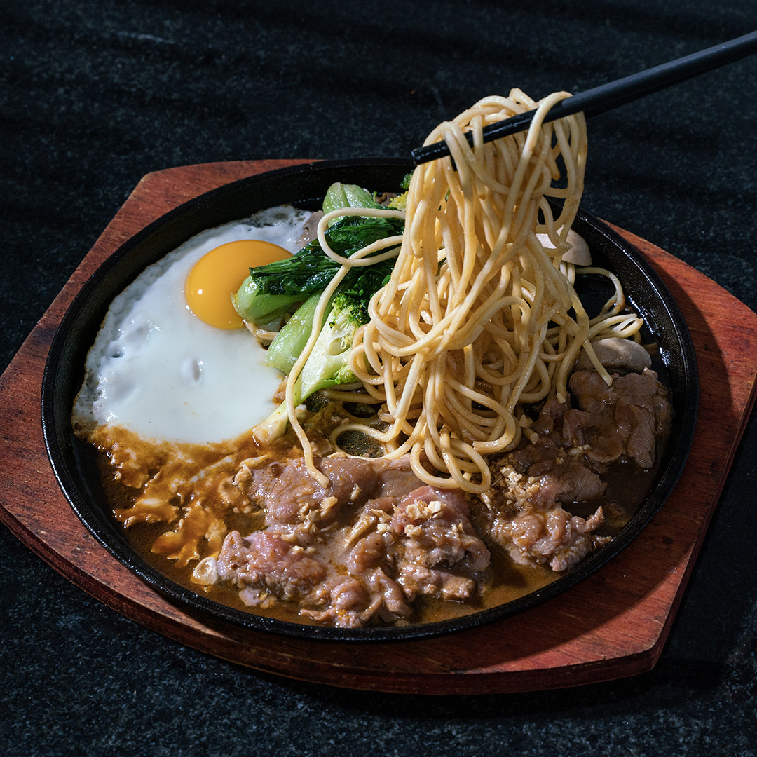 Beef fried noodle on hot pan